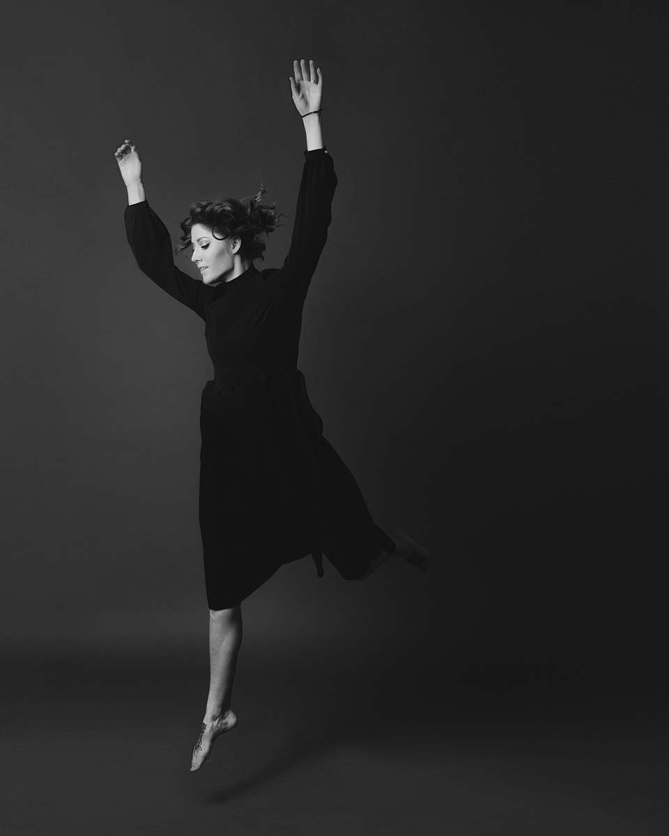 leisure activities grayscale photography of woman wearing long-sleeved dress dance pose